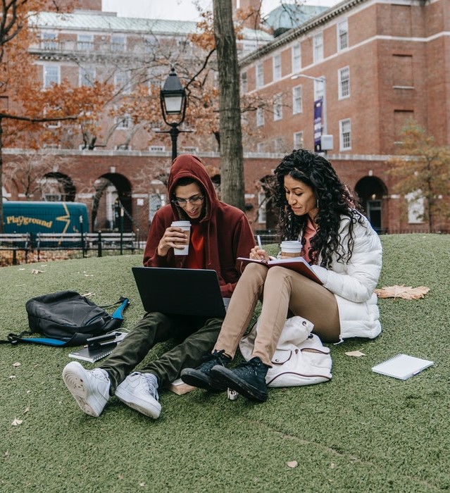 a photo of two college students studying together